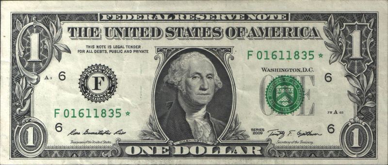 Front of a U.S. $1 star note (Series 2009) showing the serial number F01611835 with a star symbol at the end, printed in green ink in the upper-right and lower-left corners